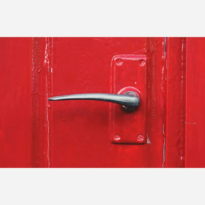 stainless steel handle lock on the red door
